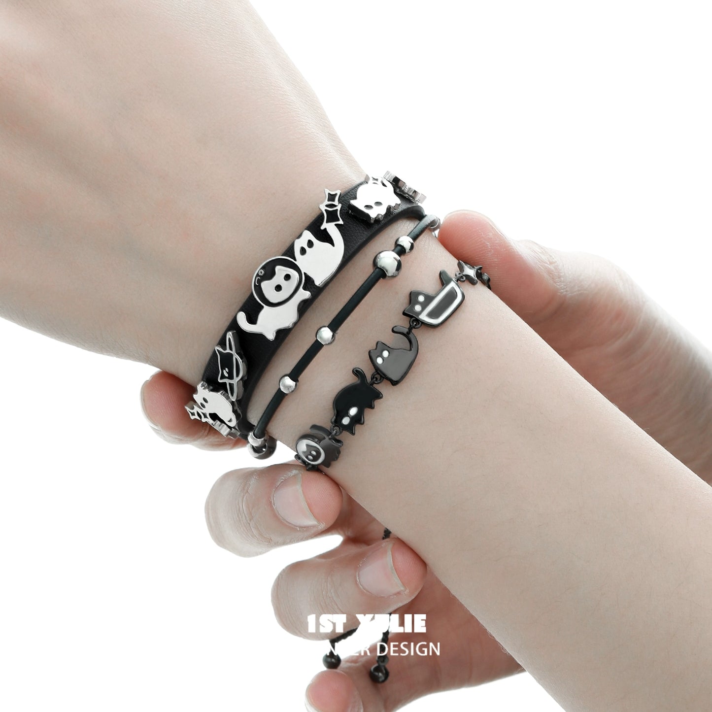 Set of black cat bracelets featuring playful designs and delicate charms for cat lovers