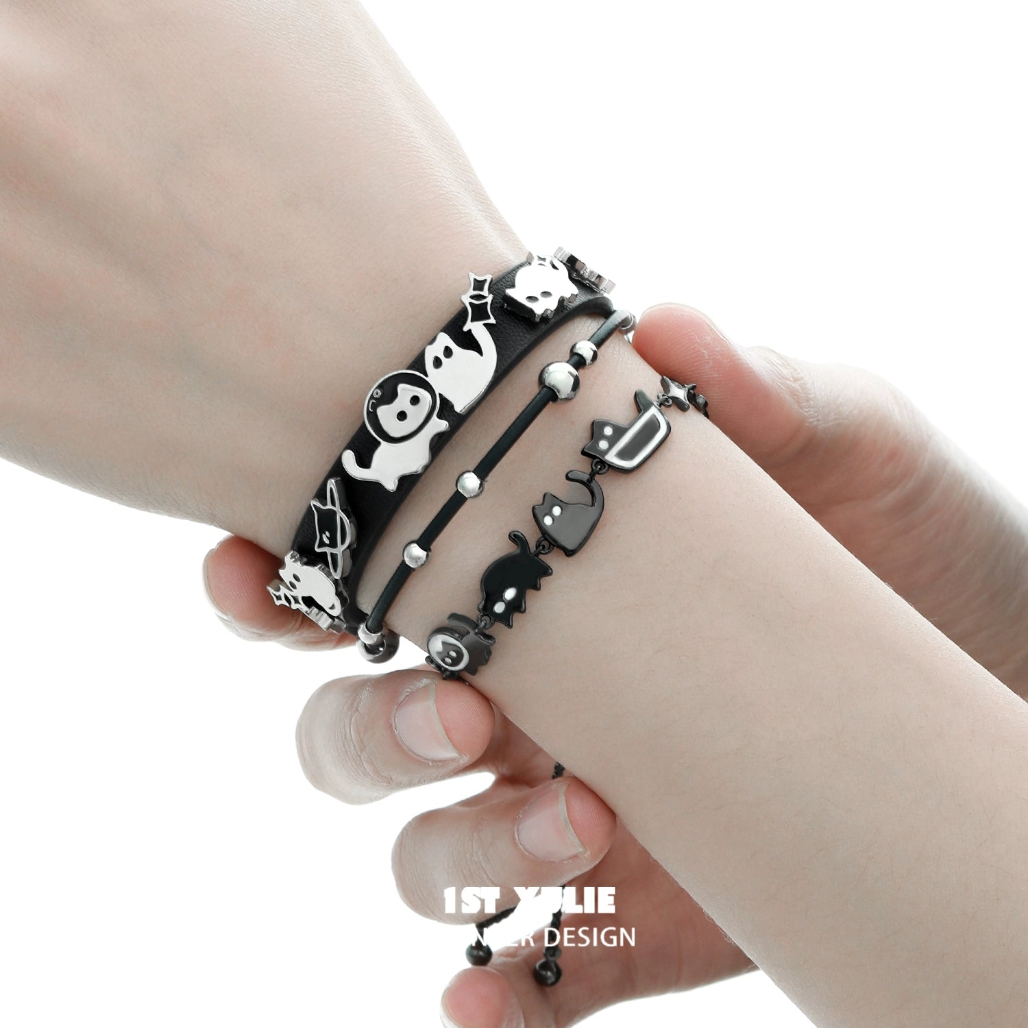 Set of black cat bracelets featuring playful designs and delicate charms for cat lovers