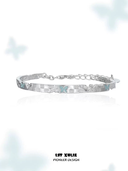 Elegant blue butterfly silver bracelet featuring intricate butterfly designs and a delicate chain.