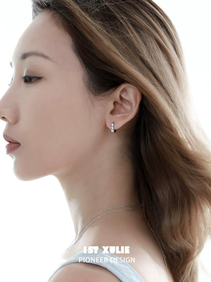 Elegant model showcasing blue cosmic earrings that add a celestial touch to any outfit