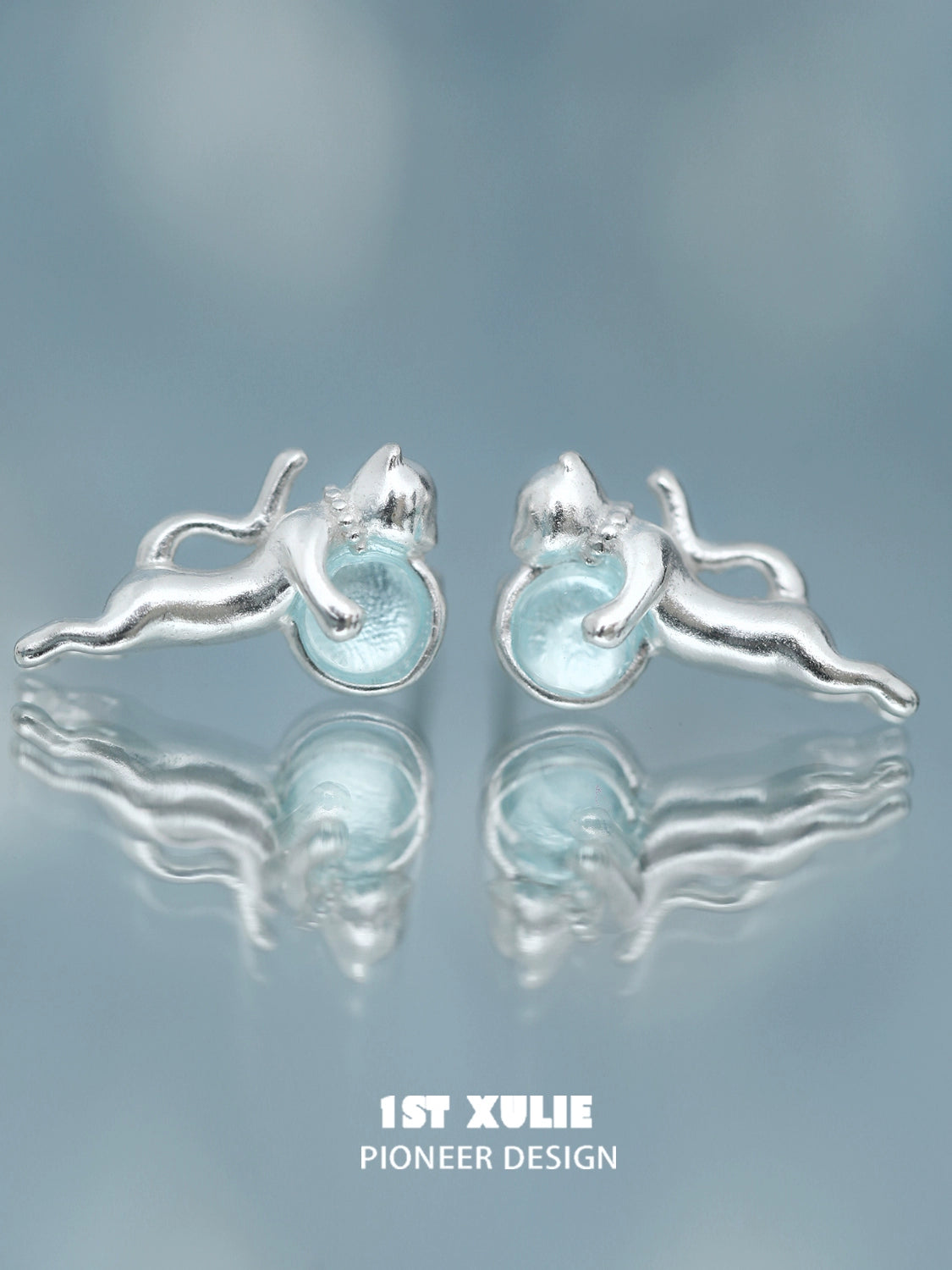 Unique silver blue kitten earrings for women featuring playful cat design and light blue accents