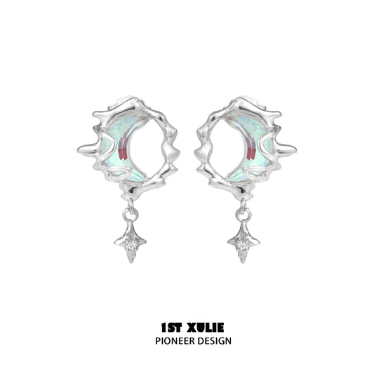 Stylish blue moon silver earrings with intricate design and sparkling details