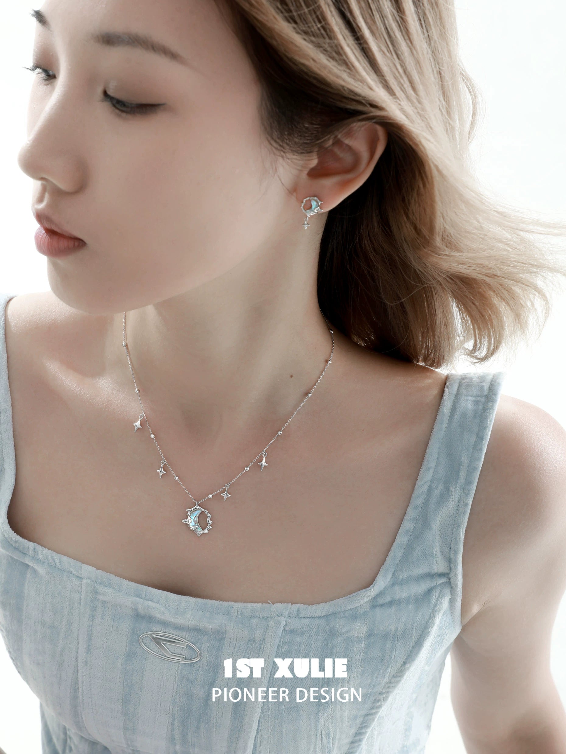 Blue Moon Silver Earrings by 1ST XULIE with a delicate design and sparkling stones