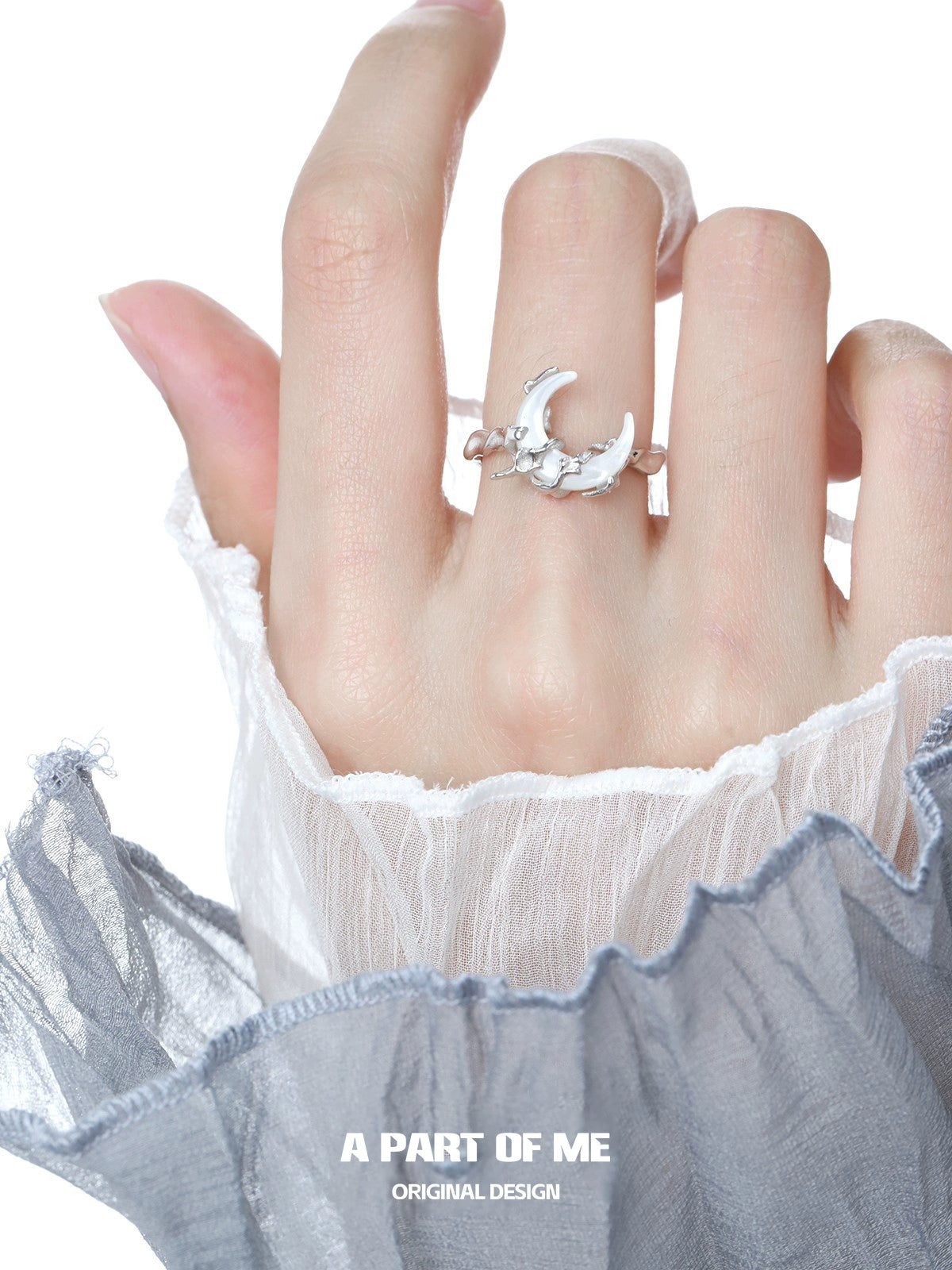 Bone orchid moon ring by A PART OF ME featuring a delicate crescent design on a hand