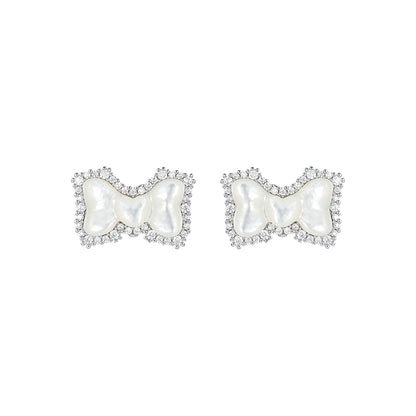 SUN HUNTER bow pearl earrings adorned with sparkling crystals for a stylish and elegant look
