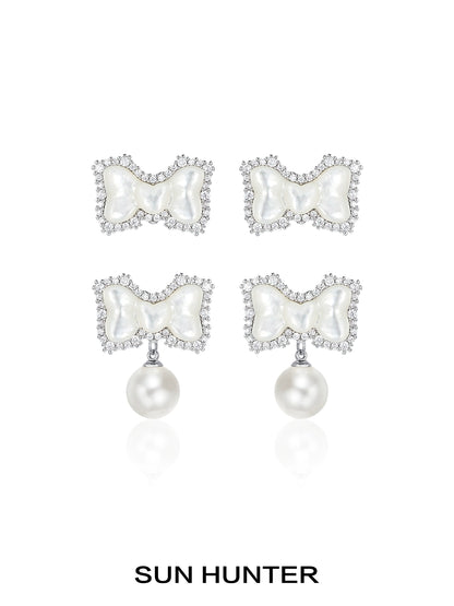 SUN HUNTER bow pearl earrings featuring a elegant bow design adorned with sparkling crystals