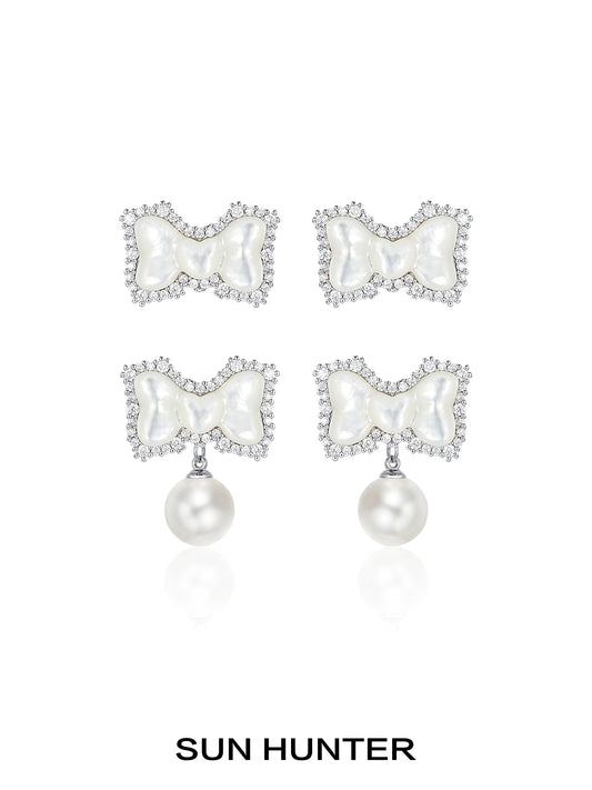 SUN HUNTER bow pearl earrings featuring a elegant bow design adorned with sparkling crystals