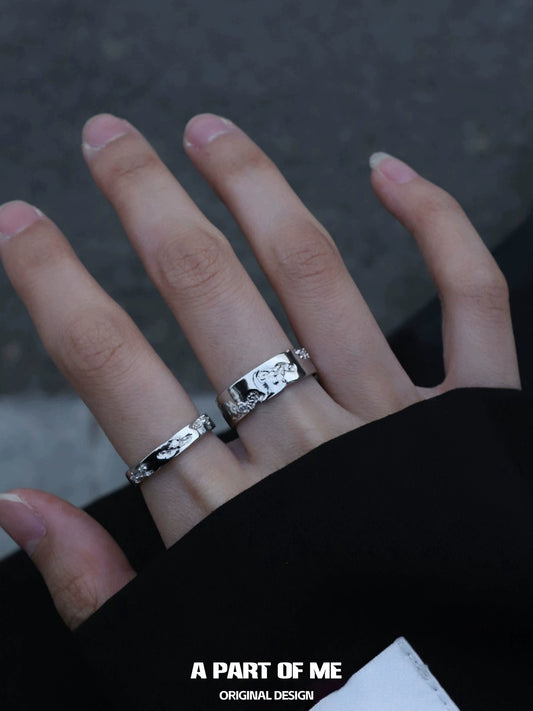 A Part of Me broken silver ring worn on a hand with artistic detailing, showcasing original design