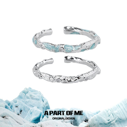 A Part of Me broken starry sky ring featuring a textured design and light blue stones