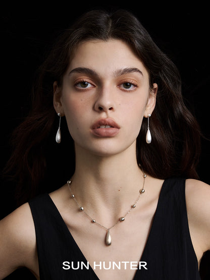 Elegant brushed teardrop earrings from SUN HUNTER, perfect for enhancing any outfit