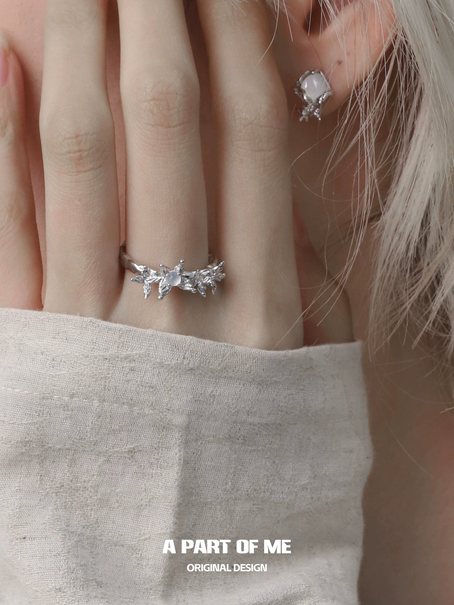 Elegant butterfly agate ring featured alongside delicate earrings for a chic accessory look