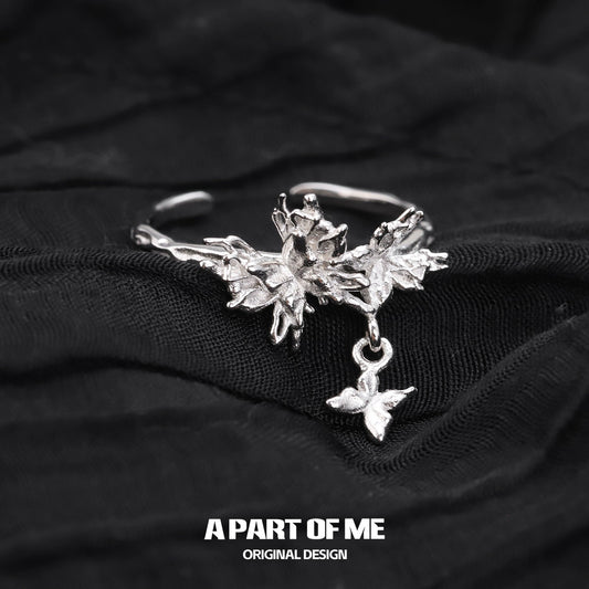 A PART OF ME butterfly charm silver ring with intricate leaf design and dangling butterfly charm