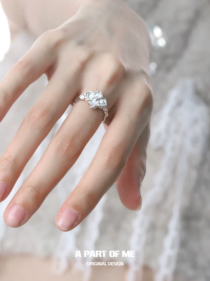 Elegant butterfly clover silver ring on a model's hand showcasing detailed design and craftsmanship