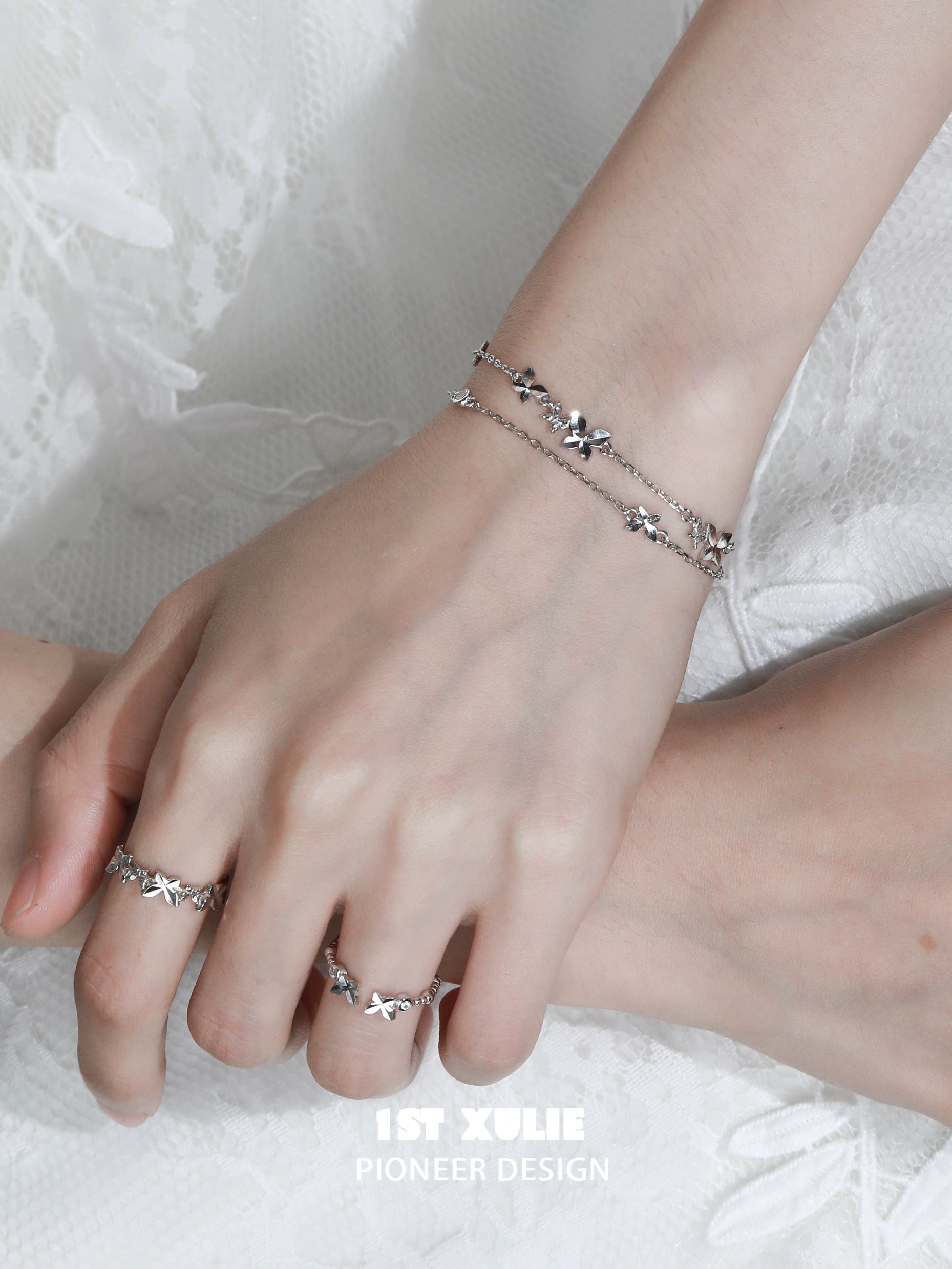 Stylish butterfly double chain bracelet in silver, layered design for elegant accessory lovers