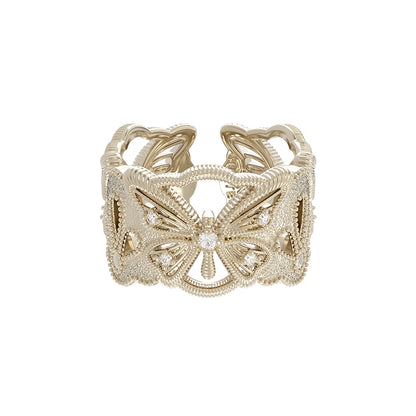 SUN HUNTER butterfly hollow ring in gold with intricate design and shimmering accents