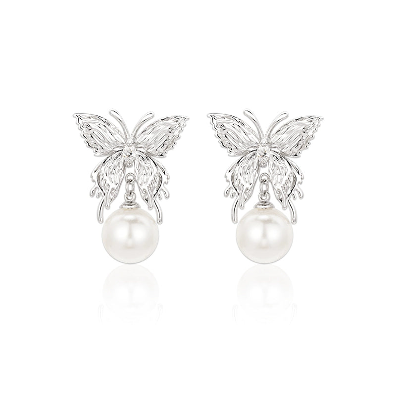 SUN HUNTER butterfly pearl earrings featuring elegant butterfly design with luminous pearls