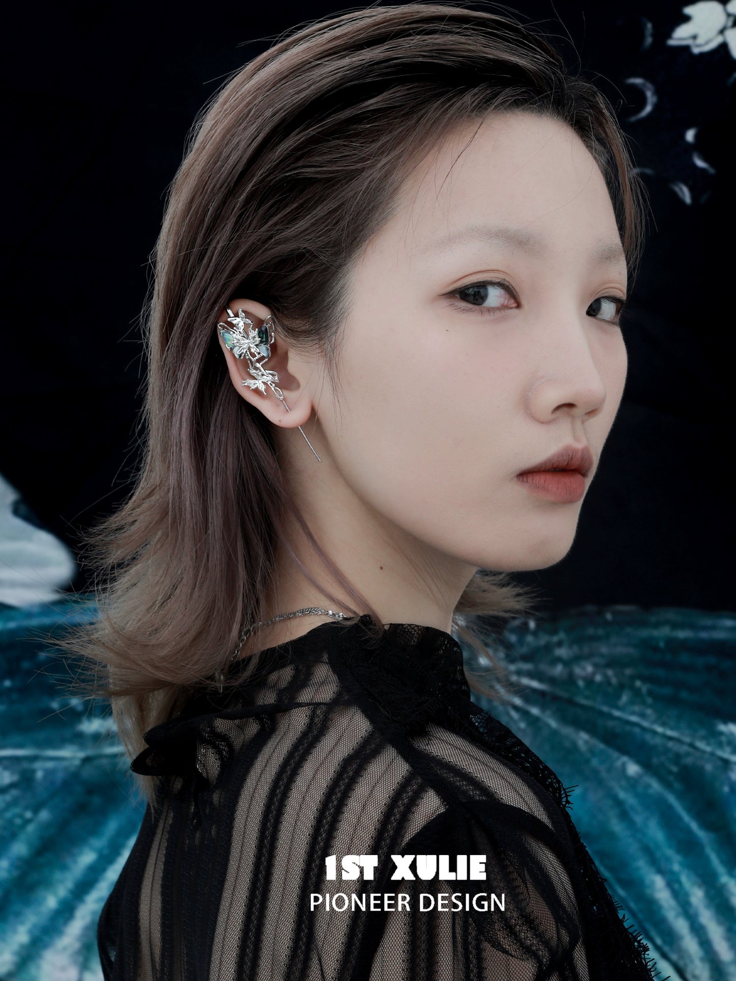 Elegant 1STXULIE butterfly piercing earrings showcased on a model with a unique design