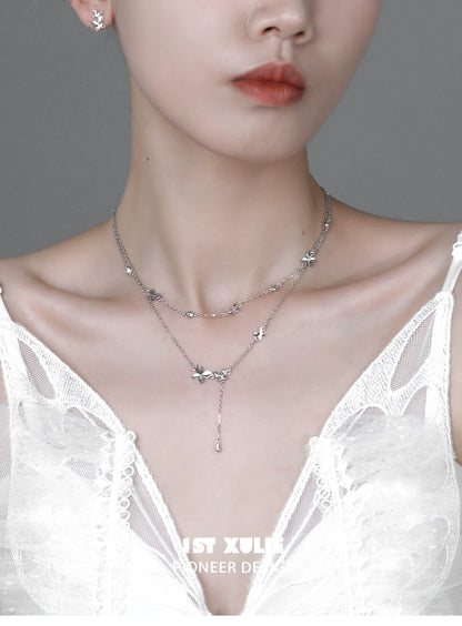 Elegant butterfly silver necklace layered with delicate butterfly charms for a stylish look