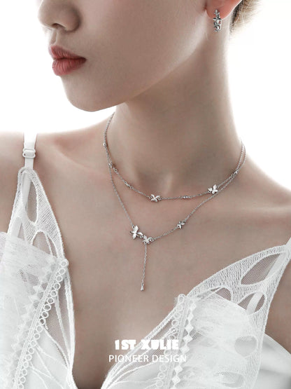 Elegant 1STXULIE butterfly silver necklace featuring a layered design with delicate butterflies
