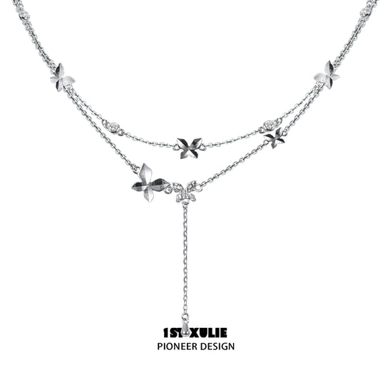 Elegant butterfly silver necklace featuring intricate floral designs and adjustable length