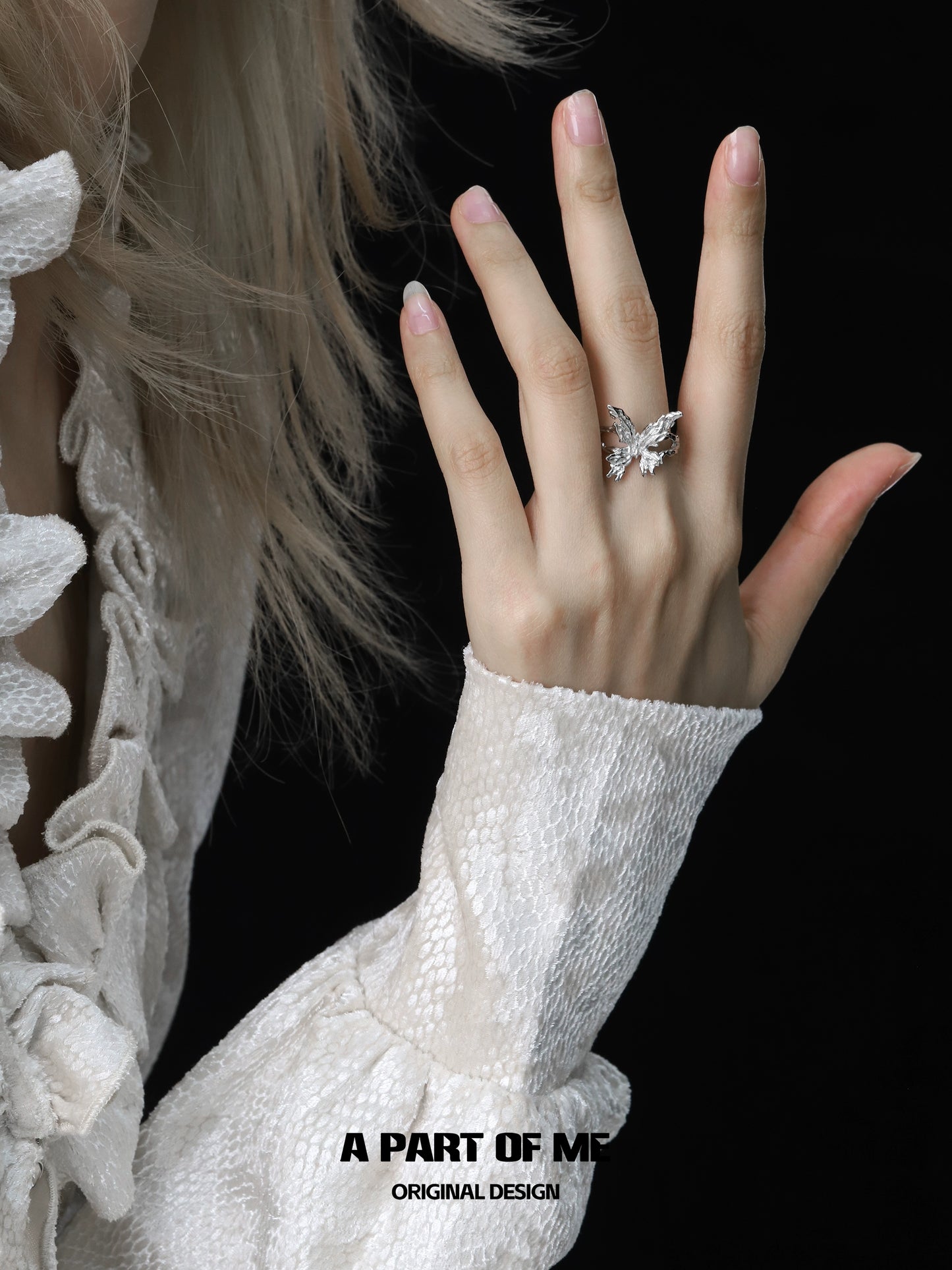 Delicate butterfly silver ring on hand, showcasing intricate design and elegance from A PART OF ME