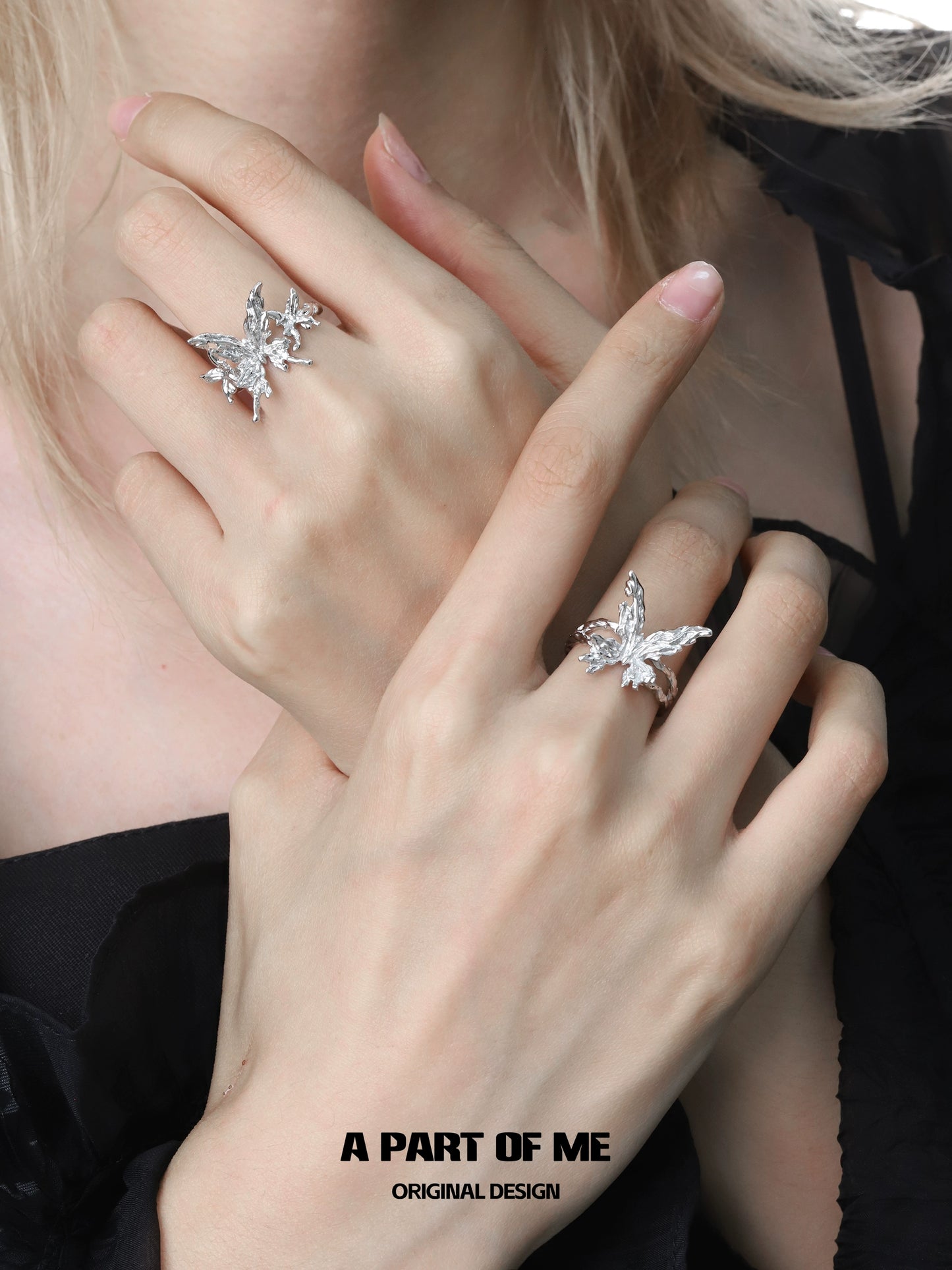 Two elegant butterfly silver rings from A PART OF ME showcased on delicate hands