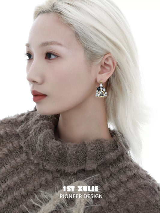 Elegant cat family silver stud earrings showcased on a model with light hair