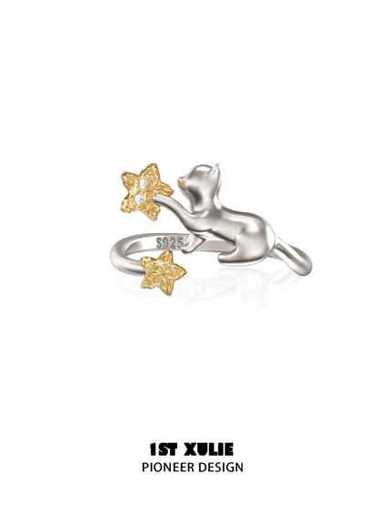 Cat silver ring featuring a playful cat design with gold star accents and detailed craftsmanship