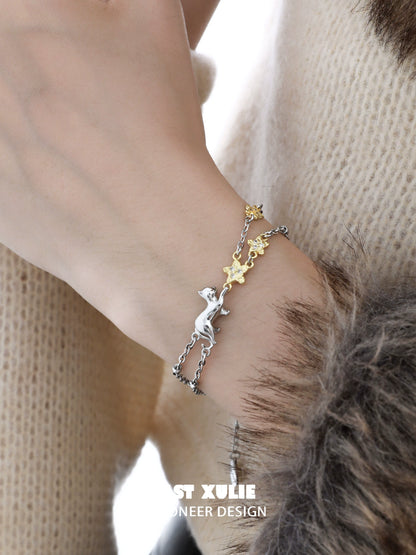 Elegant cat star bracelet featuring silver cat charm and gold star accents for a chic look