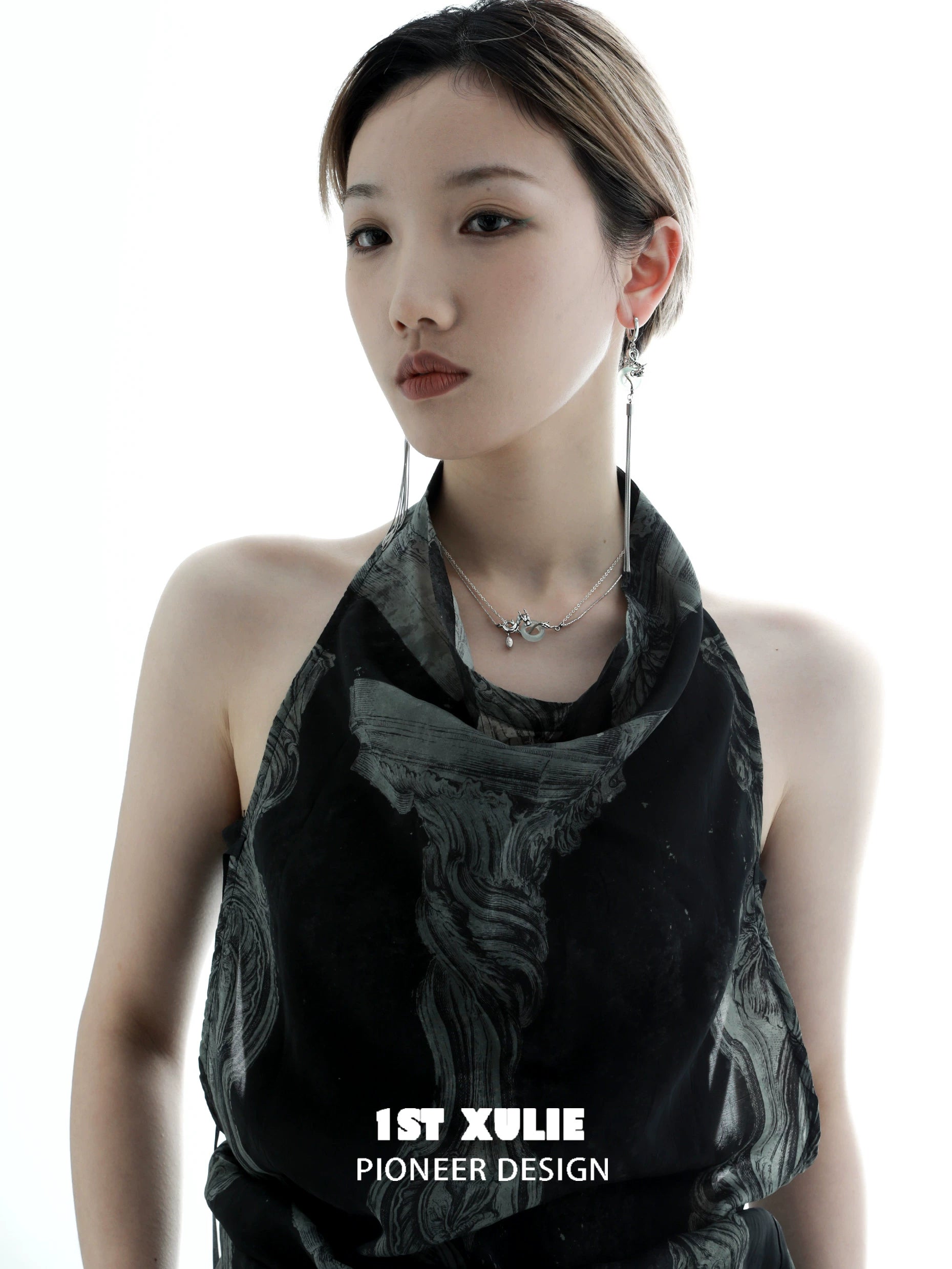 Elegant model showcasing Chinese dragon tassel earrings with intricate detailing and stylish design