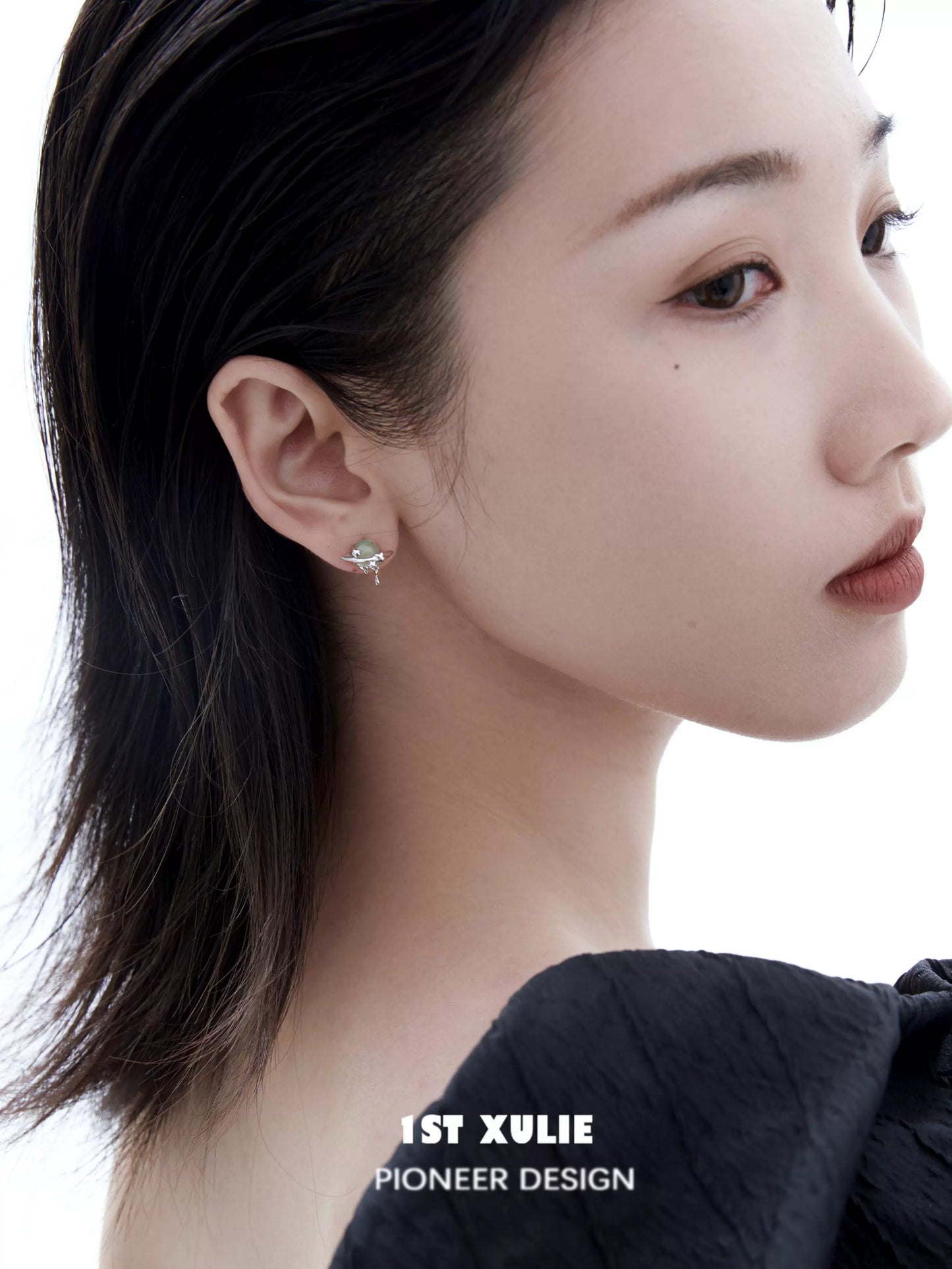 Elegant cosmic meteorite earrings showcased on a model with a sleek hairstyle