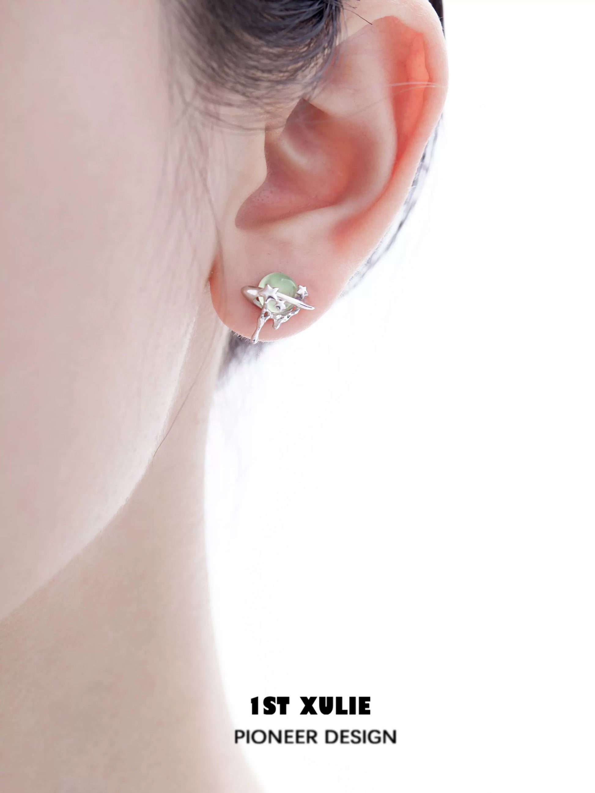 1ST XULIE Cosmic Meteorite Earrings featuring a unique planet design with gemstone accents