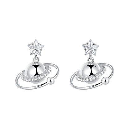 SUN HUNTER cosmic planet star earrings in silver with sparkling details and star accents