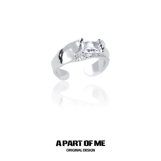 A PART OF ME cracked texture silver ring featuring a unique design and a shining stone accent