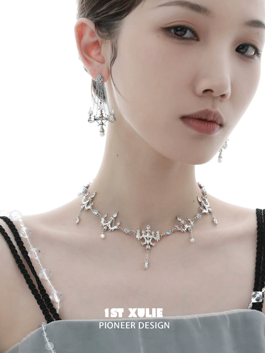 Elegant crystal fringe necklace adorned with pearls, perfect for formal occasions and stylish outfits