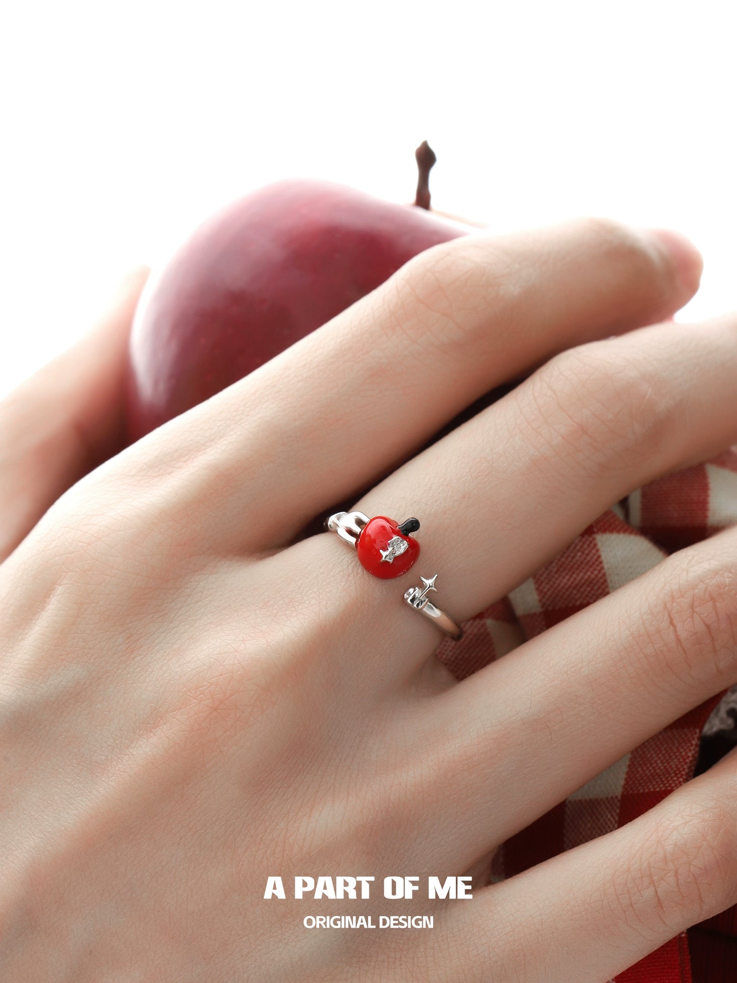 Cute apple ring from A PART OF ME featuring a shiny red apple design on a delicate band