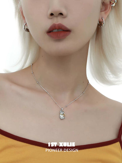 Cute cat necklace from 1STXULIE featuring a silver pendant on a delicate chain