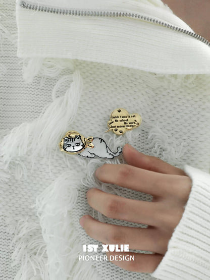 Cute cat silver brooch featuring a playful design and detailed illustration on a cozy sweater