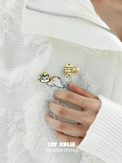 Cute cat silver brooch featuring a playful cat illustration on a stylish sweater