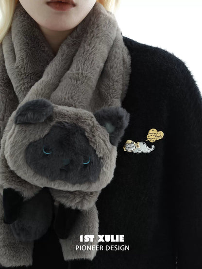Cute cat silver brooch on a black sweater with a plush gray scarf featuring cat details