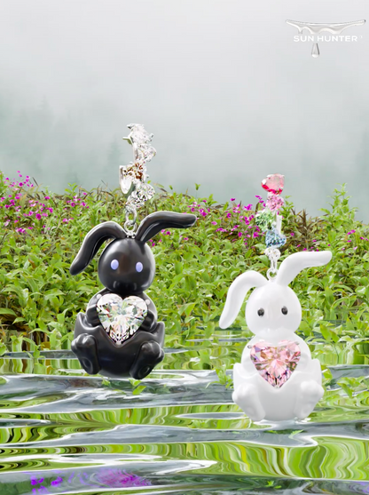 Cute enamel rabbit earrings in black and white with heart-shaped stones for a playful accessory