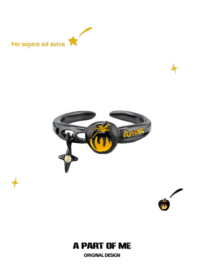 A PART OF ME dark gold apple ring with a unique black design and colorful accents