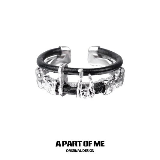 A PART OF ME dark matter leather ring featuring a unique textured design and adjustable fit
