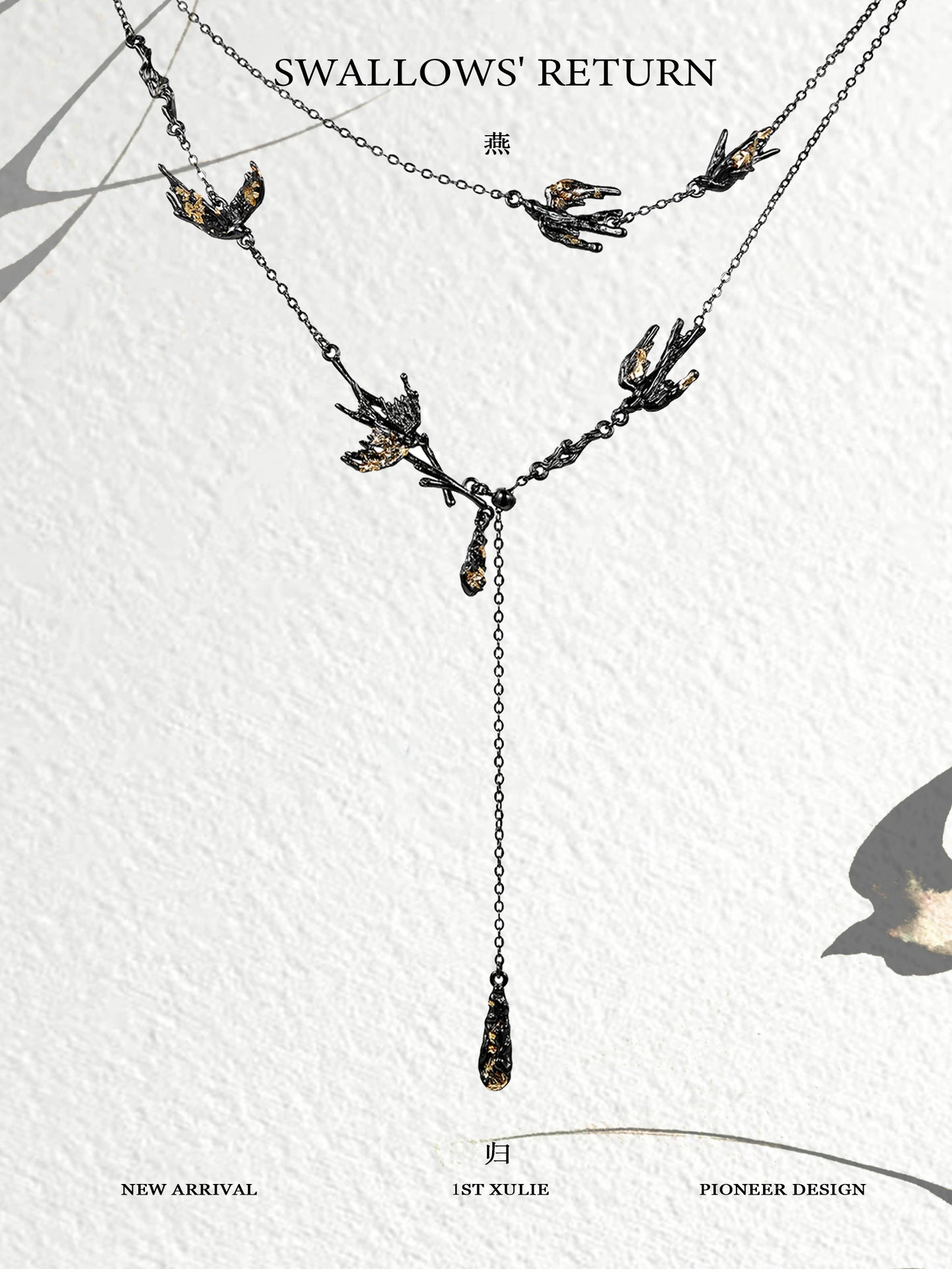 Dark swallow necklace featuring elegant design with multiple swallows and a hanging drop detail