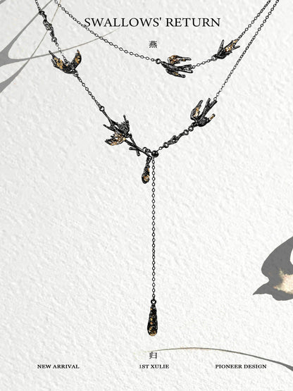 Dark swallow necklace featuring elegant design with multiple swallows and a hanging drop detail