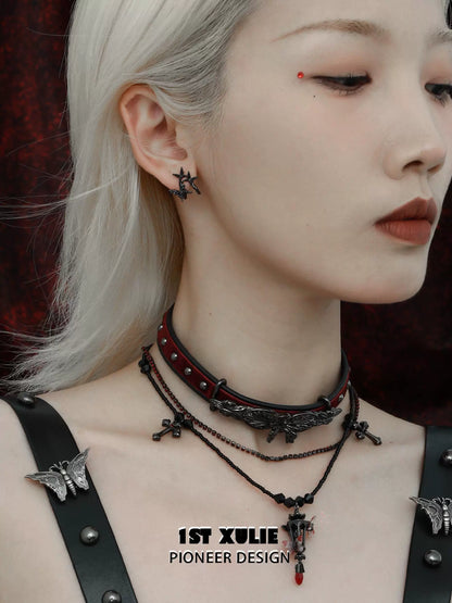 Model wearing dark thorn butterfly earrings with a gothic choker and layered necklaces for a unique look