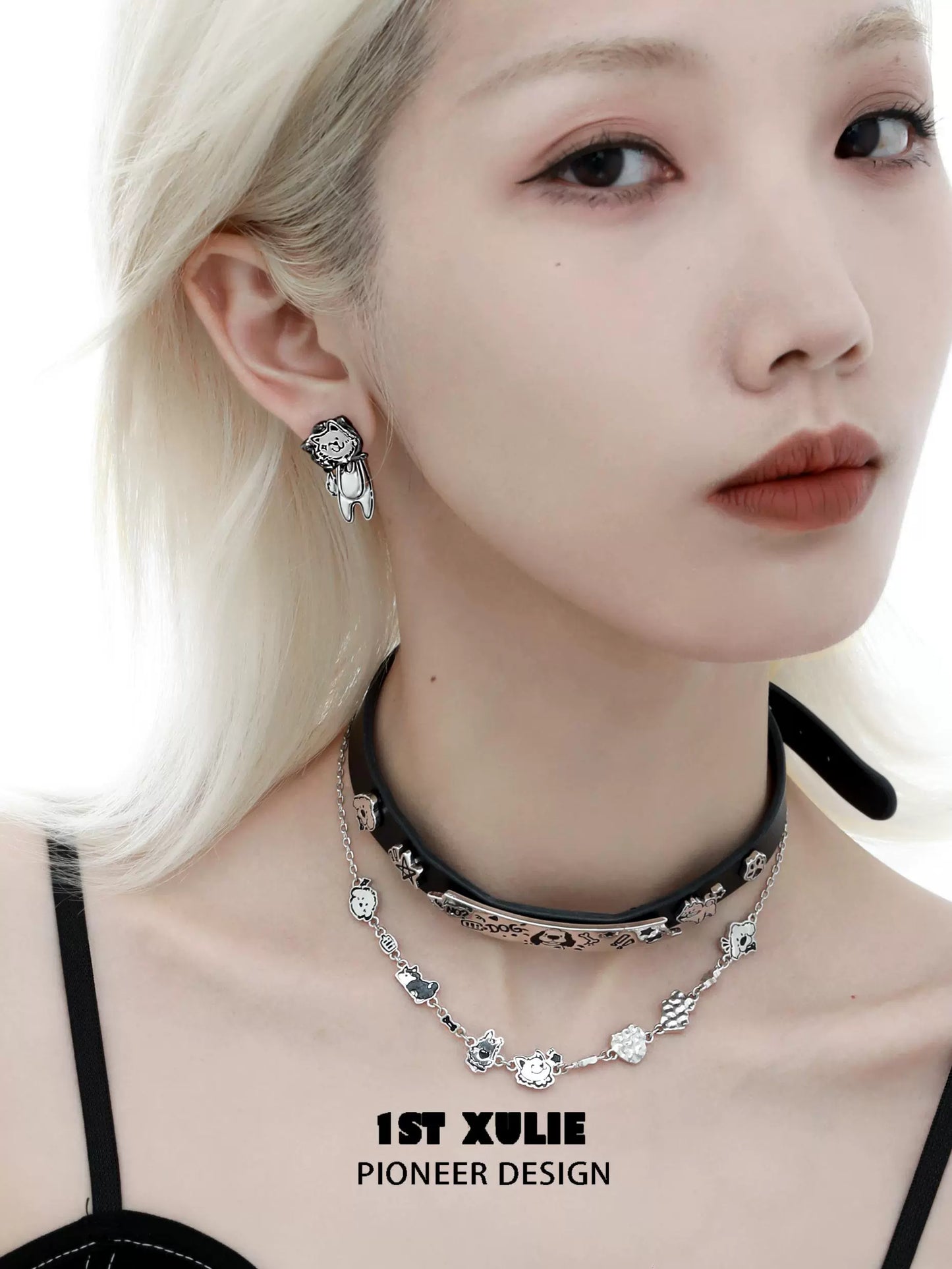 Stylish 1ST XULIE dog lover silver earrings showcased on a model with trendy accessories