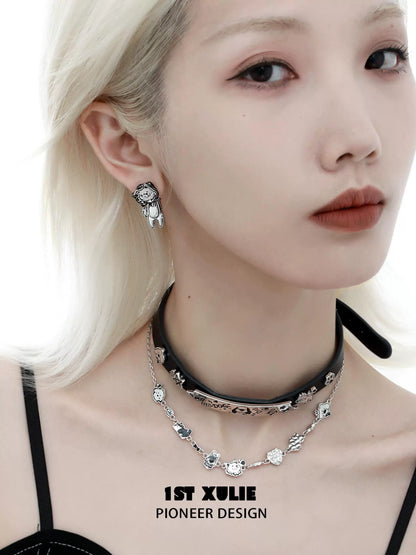 Stylish 1ST XULIE dog lover silver earrings showcased on a model with trendy accessories