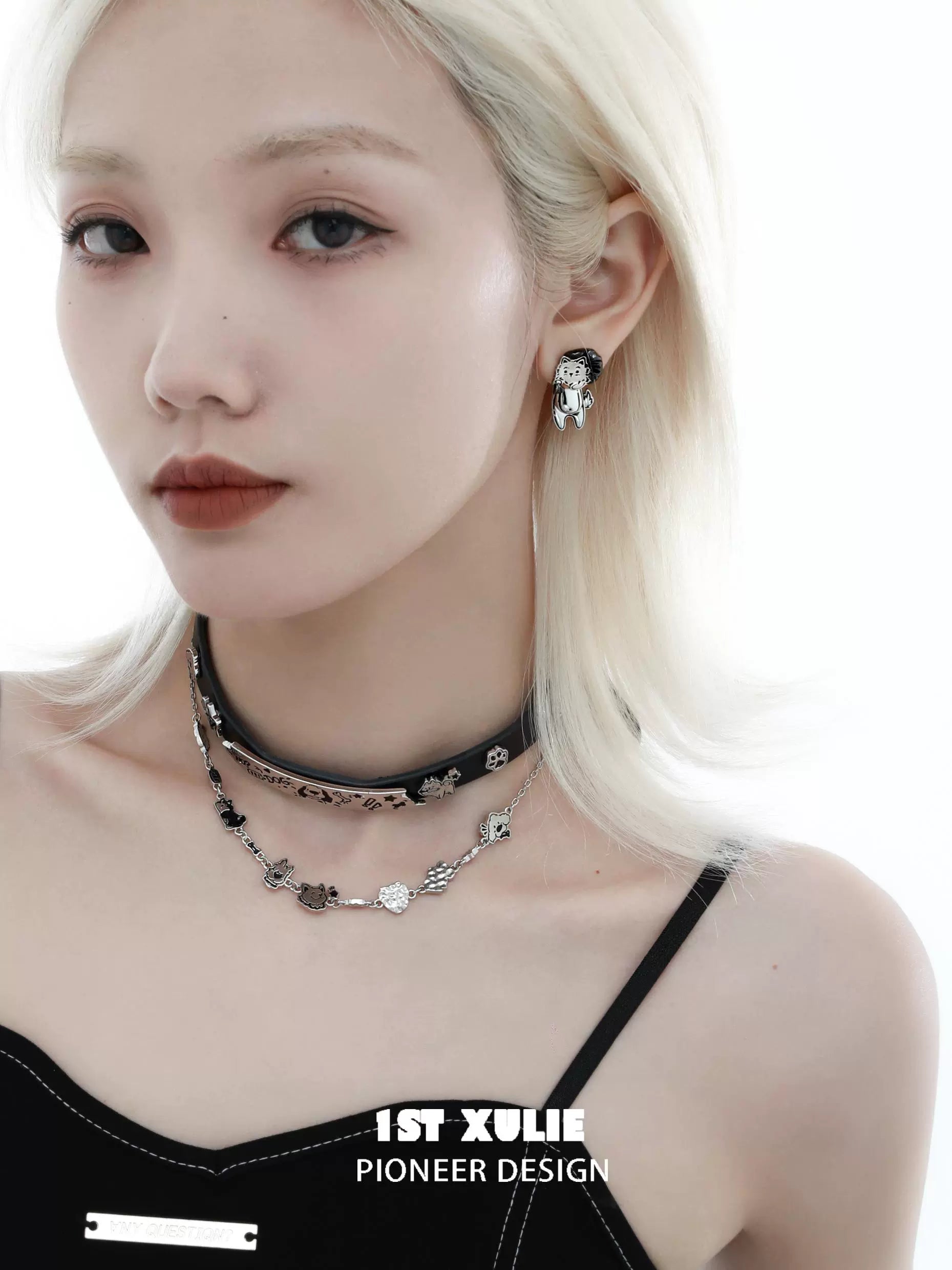 Stylish dog lover silver earrings designed for dog enthusiasts, worn by a model with a chic outfit