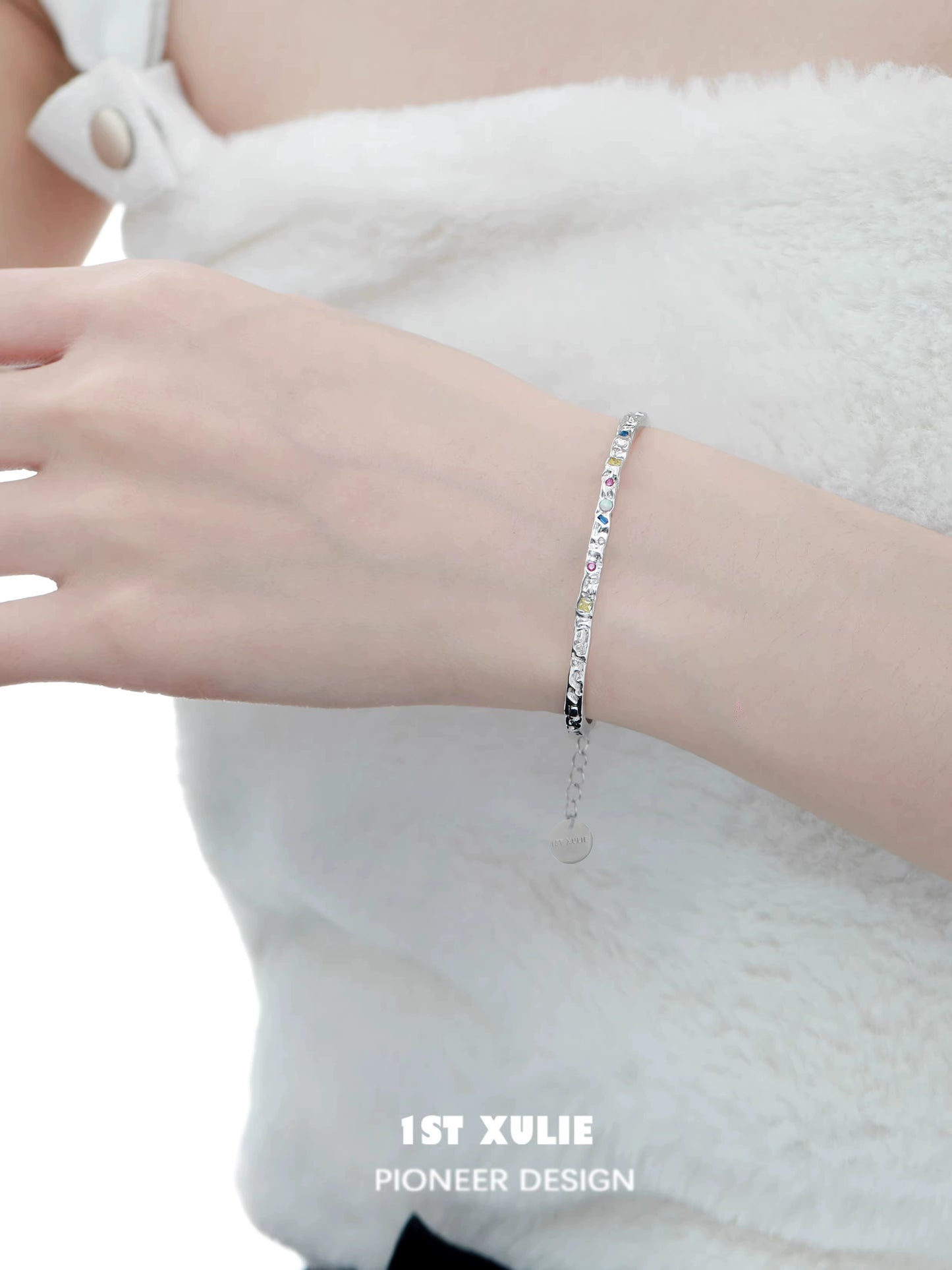 Elegant dopamine color zircon bracelet on a wrist, featuring a sparkling design for stylish occasions